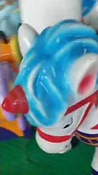 Chuck-E-Cheese carousel kiddie ride