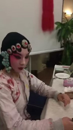 Peking Opera face painting, make-up and costume
