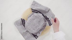 Time lapse. Baking homemade sourdough wheat bread in cast iron dutch oven.