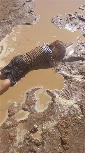Child Falls Asleep in Mud Puddle