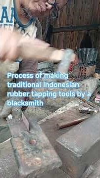 Traditional Indonesian blacksmith process making rubber tapping tools.