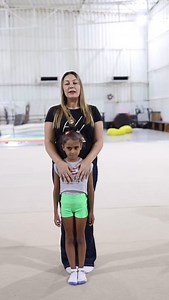 Teaching the wave. “To master the body wave, coaches should focus on teaching this element step by step. Starting with the fingers and arms, then progressing to the shoulders, neck, head, back, and knees, gymnasts can gradually learn to move each part until they achieve a fluid wave from fingers to feet. This gradual approach ensures they understand and perfect each movement.” | Lobna Arouss Rhythmic gymnastics center