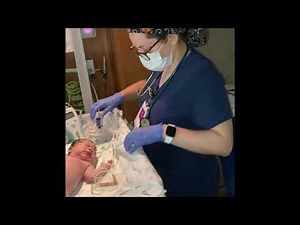 Newborn baby girl examination/check after birth.