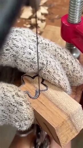 Cutting small wood with a fine saw to create a unique pattern