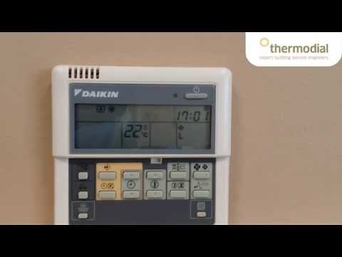 How to change the time and day on a Daikin air conditioning controller