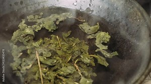 the brewed tea leaves during the tea ceremony.Brewing tea in the style of the Tang dynasty. A staged ceremony of brewing Chinese tea the original method.