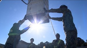 Navy reservist sailors hone skills loading Tomahawk cruise missiles onto warships