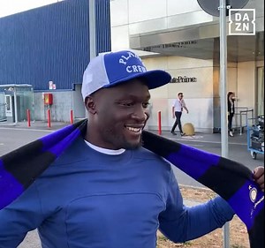 Lukaku holds up Inter scarf as he lands in Italy to seal £6.9m loan transfer