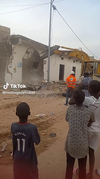 Demolition Process Captured: Exciting Excavator Action