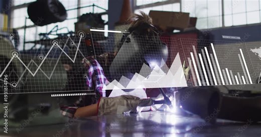 Welder igniting torch and welding at bench, industrial HUD overlaying graphs tracking output