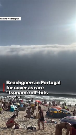 Beachgoers in Portugal scrambled for cover over the weekend as the sweltering heat gave birth to a rare “tsunami roll,” an ominous wave of dark clouds over the water. https://trib.al/W8UyR4M | New York Post Lifestyle