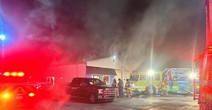 Firefighter injured when roof collapses in burning Lapeer building