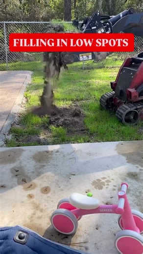 Uneven ground around your yard? This is how we fix low spots the right way — fill first, then grade it smooth.#fyp #lawncaretok #worktok #bluecollar #ContractorLife