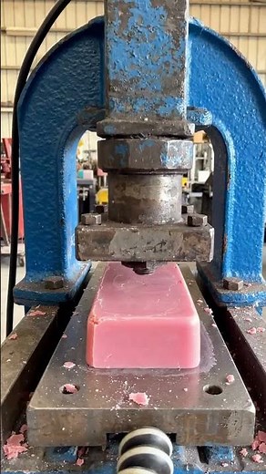 soap bar under hydraulic press