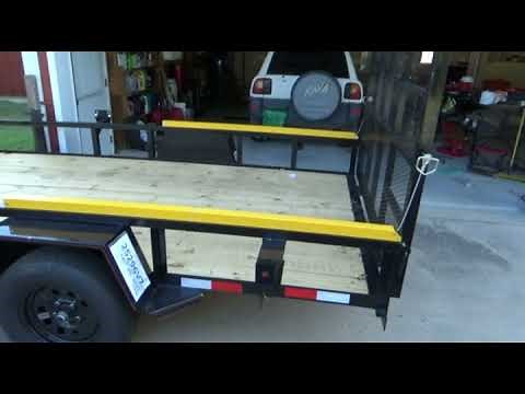 Gorilla-lift Trailer Gate Assist - Lowering gate into trailer floor