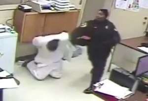 Caught On Surveillance: Female Prison Guard Smacks A Handcuffed Inmate While Fellow Officers Sit Back And Watch!