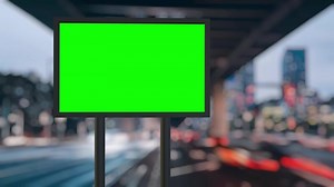 Green screen billboard with changing timelapse city background