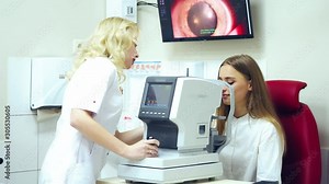 Ophthalmology technology. Woman doctor working with a patient using refractometer machine. Modern device for testing eye vision.