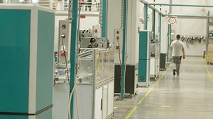 clip-3450457551-factory-worker-walking-by-modern-injection-moulding