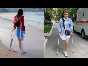 Amputee lady crutches user: life after amputation adaptation with mobility