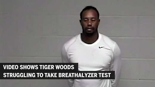 WATCH: Video from a Florida jail shows a barefoot and handcuffed Tiger Woods performing two DUI tests. http://bos.gl/2UpNlhL | The Boston Globe