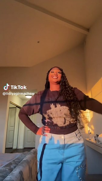 Fun Dance Poses in a Cozy Bedroom Setting