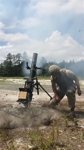 120mm mortar sending one down range. | We Are The Mighty