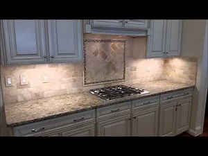 Travertine Backsplash with Herringbone Inlay