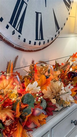 Jennifer Dempsey on Instagram: "Wait until you see this beautiful fall candle centerpiece I made for my entry table using pool noodles, glasses, zip ties and stems from Dollar Tree. I used zip ties between the vases to secure them in then had fun using varieties of stems from Dollar Tree. I love the lead stems and the mums are great to fill in the gaps. The more variety creates the volume and texture for a custom high-end look. I also added my favorite acorn picks and beautiful muted pumpkins al