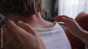 Allergic skin reaction on the childs neck and face - red rash. Symptoms of photodermatitis. Allergic reaction to sunlight