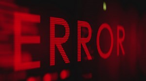 Pixelated red error message on a laptop screen  - Free Stock Video