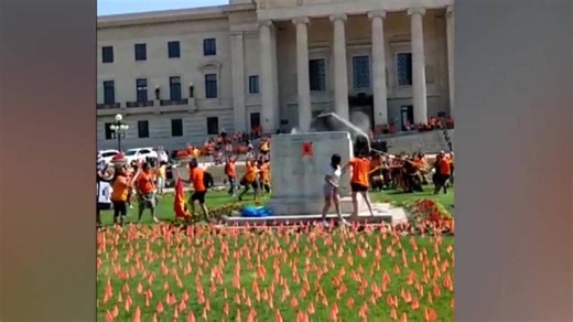 The pedestal of a toppled statue at the Manitoba legislature is being removed