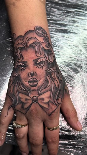 Clown girl tattoo #hand #tattoo #tattoos #clown #doll