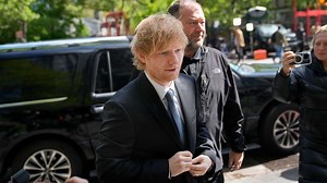 Ed Sheeran plays guitar on the stand in his copyright trial