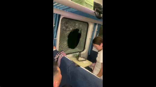 Passenger smashes window for air after 3-hour delay in 38C heat following train collision in China