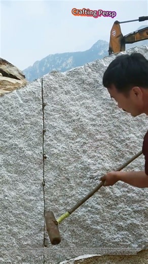 Watch Skilled Worker Crack Huge Boulder
