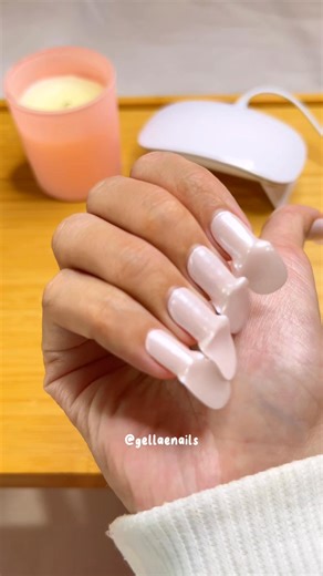 You can get pink hailey glazed donut nails at home without the nail damage! Gellaes are gel nails in a sticker form that hardens to the shape of your nails once cured under the UV lamp! They’re super easy to put on and remove at the comfort of own home! #diynails #glazednails #gelnailsathome #gelnailhack #nailgrowth | Gellae