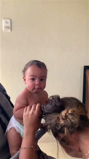 Baby Playfully Pulls Mother's Hair
