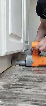 demonstration on how to cut plywood under a kitchen cabinet toe kick.