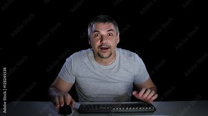 Man happily surprised at what he saw in the computer monitor