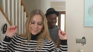 Worlds most annoying couple dancing. Slider shot of cringe-worthy matching-clothes couple dancing indoors