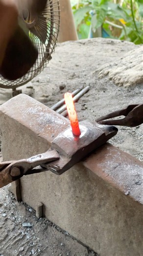 Forging industrial iron components inside an authentic American blacksmith shop