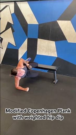Modified Copenhagen plank with weighted hip dip