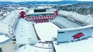 20K views · 267 reactions | Wow! Check out this stunning drone footage of snow-covered University of Arkansas and Razorback Stadium! : Charles Peek | The Weather Channel | Facebook