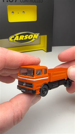 Jan Jones on Instagram: "Today I’m testing the Carson 1:87 Mercedes-Benz 1620 flatbed truck with trailer in 100% orange — a high-precision RC model made for H0 railway dioramas and serious scale enthusiasts. Despite the tiny 1:87 scale, this truck delivers fully proportional steering and speed, working LED lights front & rear, and even a controllable engine sound via remote. Thanks to its small turning circle, it’s perfect for tight streets and realistic maneuvering on model layouts. Tiny scale,