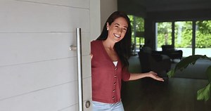 Cheerful Young Woman Opens Door Standing Stock Footage Video (100% Royalty-free) 3569466209 | Shutterstock