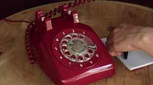 Download Answering an Old Vintage Red Phone And Taking Notes for free