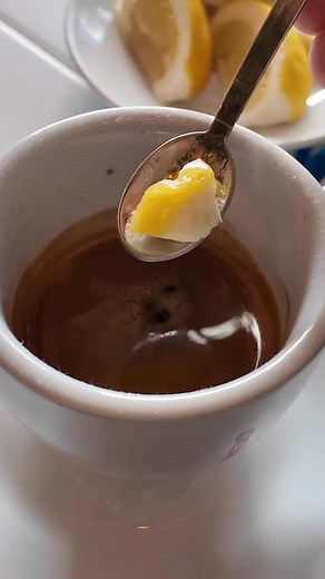 Ever seen a lemon rind served with an espresso and wondered why? 🍋☕️ It’s not just for looks — it’s a southern Italian touch, a Campanian ritual that traces back to the Amalfi and Naples coastlines. The lemon’s oils brighten the aroma and balance the bitterness of a strong espresso — a tradition born in the heart of Italy’s sun-kissed coffee culture. Some call it “Espresso Romano,” though its true roots belong to Campania, where lemons are gold and espresso is sacred. 🇮🇹 Next time you sip one