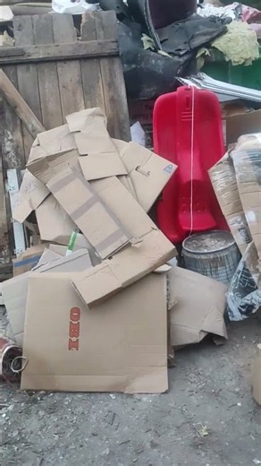 Trash zone. All sorts of junk on the street—dumpsters, bulky waste, piles of clutter.