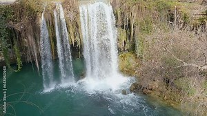 Waterfall, water falls down with splashes from a great height, slow motion, top view